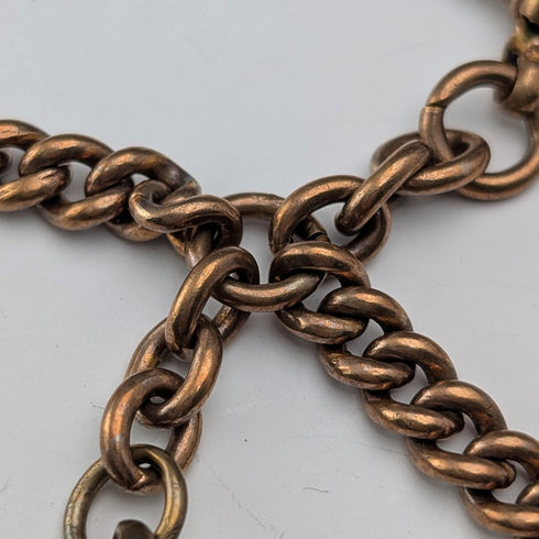 Antique British rolled gold double Albert chain with brass key fob